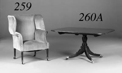 A late George III mahogany and upholstered wing armchair