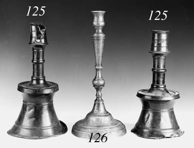 A TURKISH BRONZE TAPERING CANDLESTICK