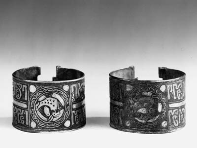 A PAIR OF PERSIAN SILVER NIELLO AND GILT BANGLES