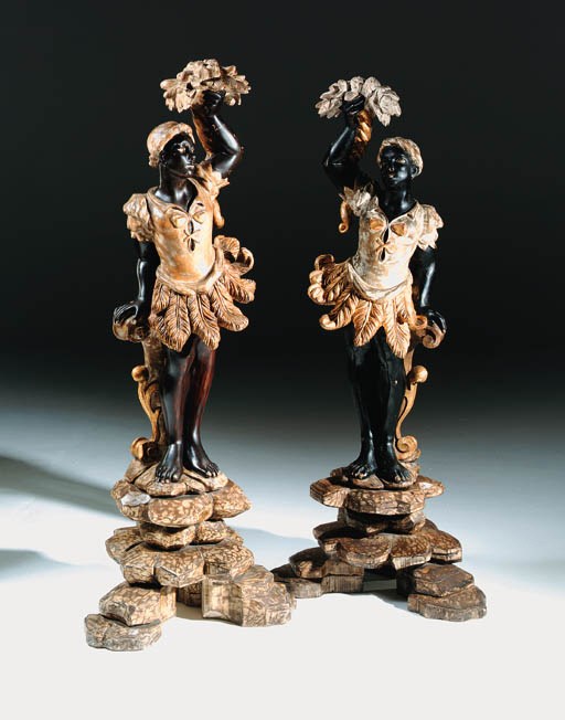 A pair of Venetian gilt and painted blackamoor figures