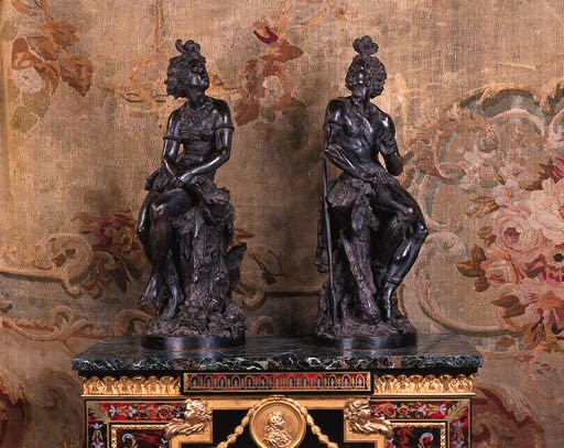 A pair of French bronze figures of a Nubian man and woman