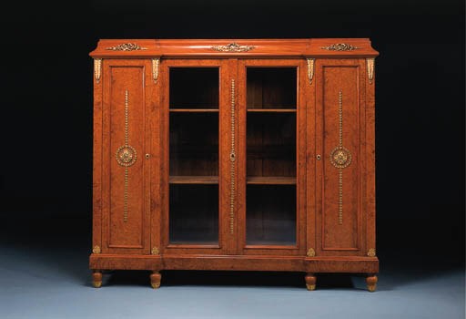 A French ormolu-mounted thuya and bois satine library suite