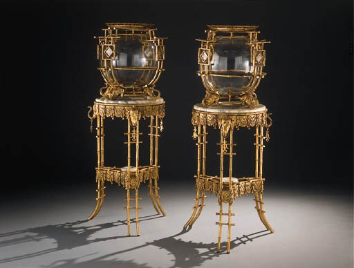 A pair of French ormolu and glass fish-bowls and stands