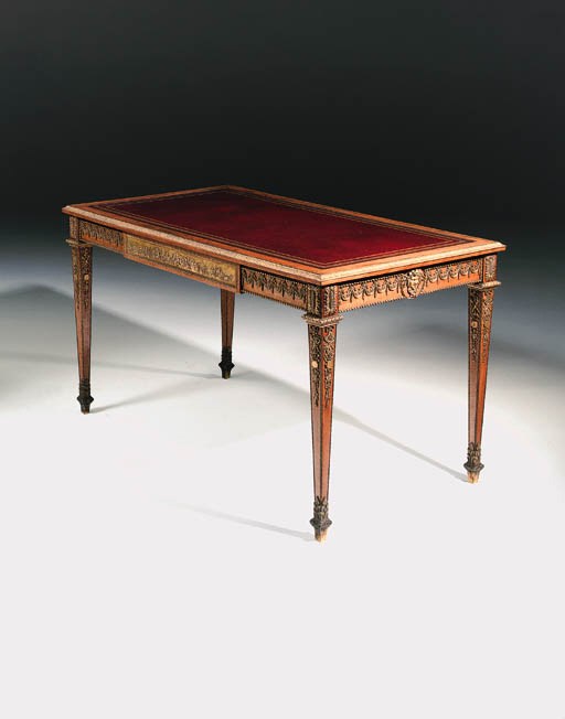 A French ormolu-mounted mahogany bureau plat