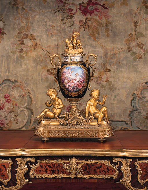 An ormolu and Sevres-pattern dark-blue-ground porcelain orbit clock