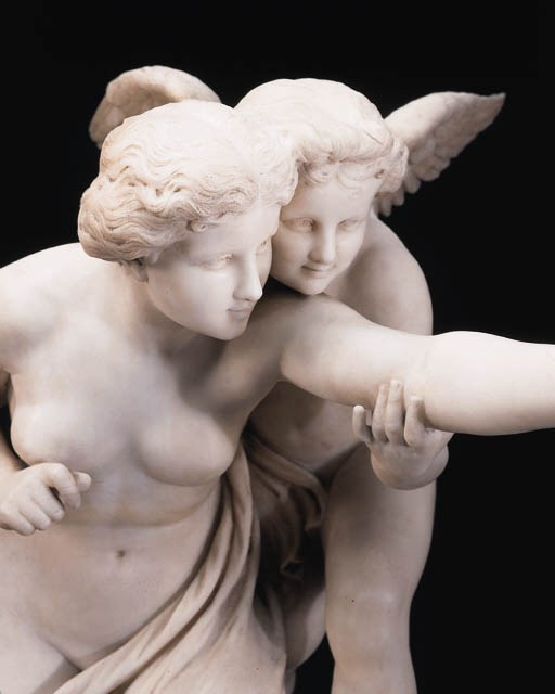 A German white marble group, entitled 'Amor als Lehrer' (Cupid the Teacher), on pedestal