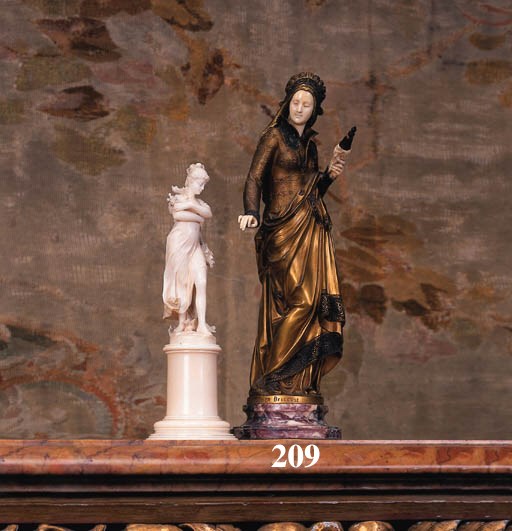 A French gilt bronze and carved ivory figure entitled 'La Fileuse'