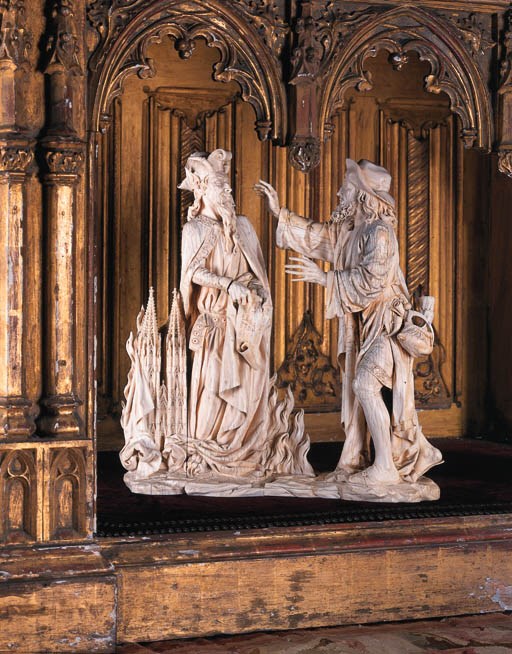 A carved ivory group of Faust and Mephistopheles