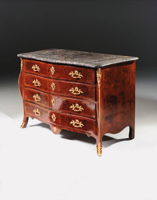 An ormolu-mounted walnut commode