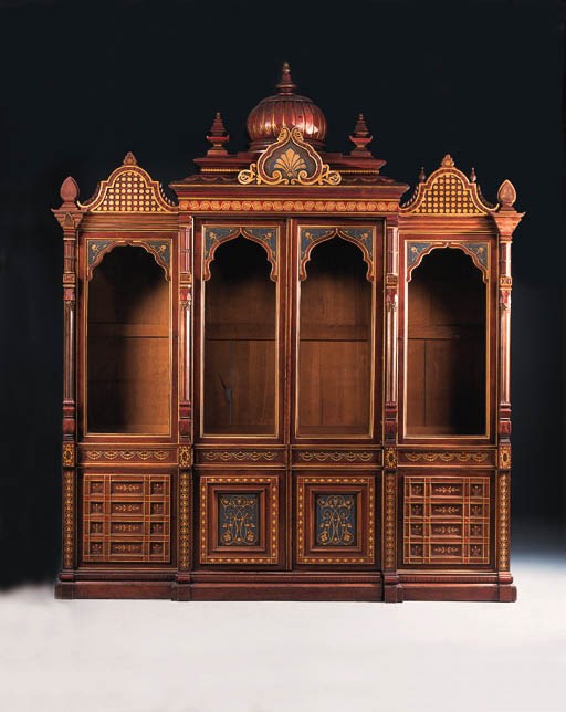 A French parcel-gilt and polychrome-decorated bookcase