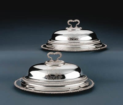 A PAIR OF GEORGE III/REGENCY SILVER MEAT DISHES AND COVERS