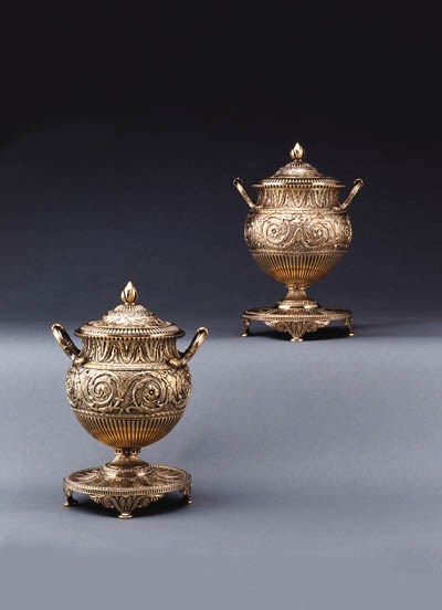 A PAIR OF GEORGE III SILVER-GILT VASES AND COVERS