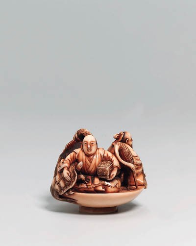 AN IVORY NETSUKE