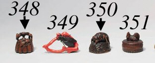 A CORAL AND IRON NETSUKE