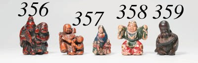 A LACQUERED YELLOW WILLOW WOOD NETSUKE