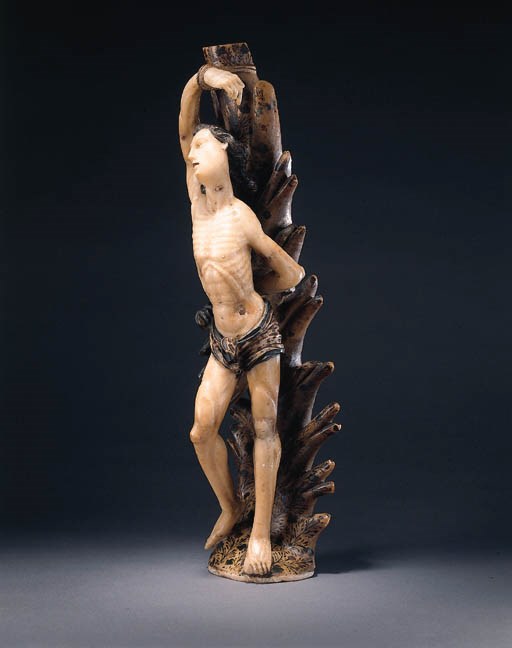 A PARCEL-GILT POLYCHROME CARVED ALABASTER FIGURE OF SAINT SEBASTIAN
