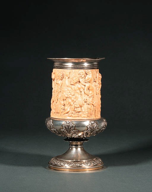 A PARCEL-GILT SILVER AND IVORY CUP
