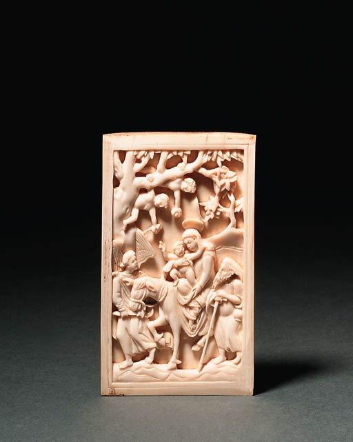 A CARVED IVORY RELIEF OF THE FLIGHT INTO EGYPT