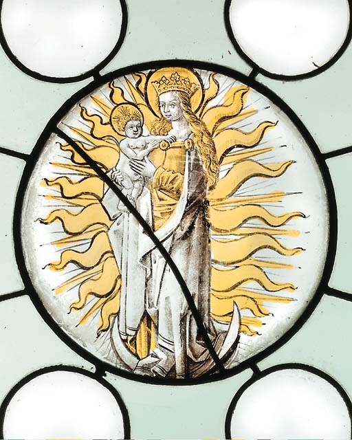 A SQUARE STAINED GLASS PANEL DEPICTING THE VIRGIN AND CHILD