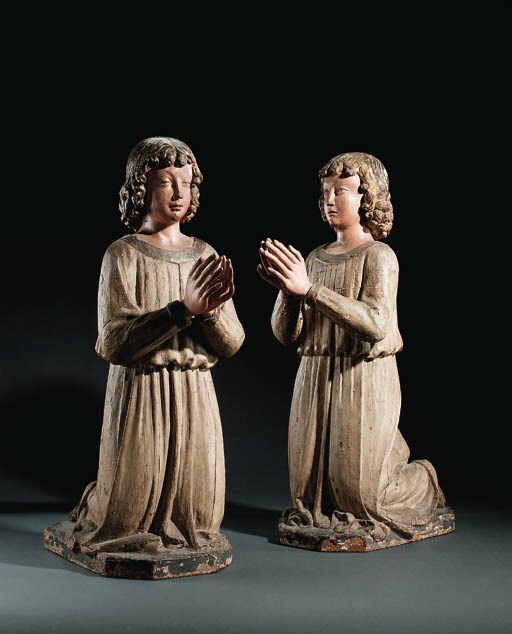 A PAIR OF PARCEL-GILT POLYCHROME CARVED WOODEN FIGURES OF KNEELING ANGELS