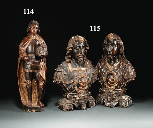 A PARCEL-GILT POLYCHROME CARVED WOODEN FIGURE OF A MALE SAINT