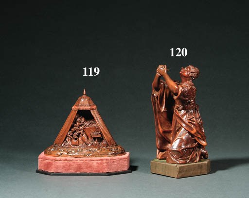 A CARVED WOODEN FIGURE OF SAINT MARY MAGDALEN