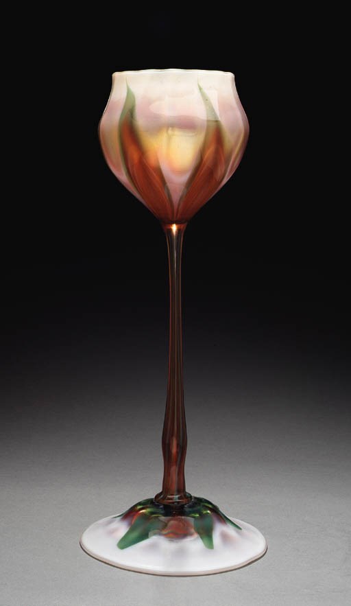 A FAVRILE GLASS FLOWER FORM VASE