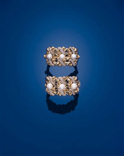 A PAIR OF SOUTH SEA CULTURED PEARL, DIAMOND AND 18K GOLD BANGLES, BY GARRARD & CO.