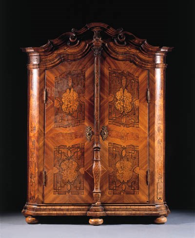 A German figured walnut, walnut and marquetry Kleiderschrank