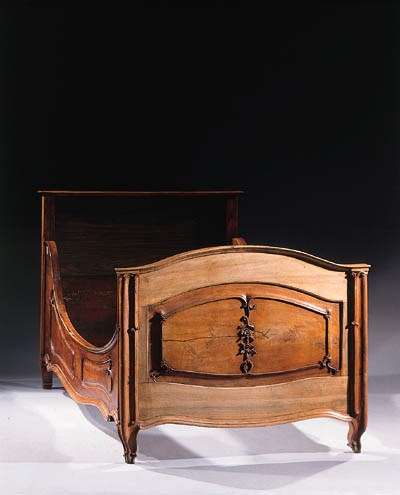 A German solid figured walnut bed