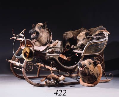 A polychrome painted wooden and metal sledge