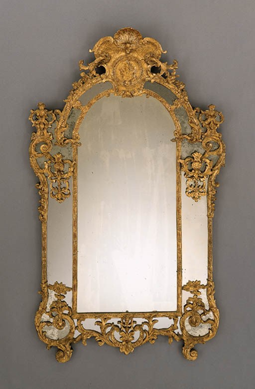AN EARLY LOUIS XV GILTWOOD MIRROR
