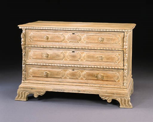 AN ITALIAN BAROQUE STYLE CREAM-DECORATED COMMODE