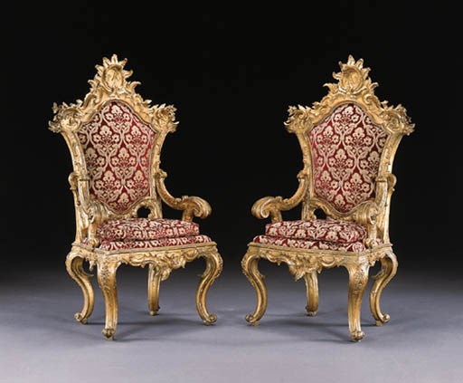 A PAIR OF ITALIAN BAROQUE GILTWOOD THRONE ARMCHAIRS