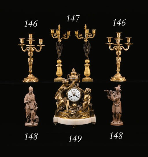 A PAIR OF RESTAURATION ORMOLU AND PATINATED BRONZE THREE-LIGHT CANDELABRA