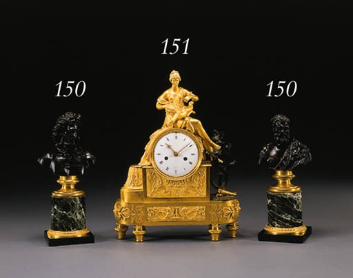 A DIRECTOIRE ORMOLU AND PATINATED BRONZE MANTEL CLOCK