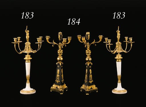 A PAIR OF EMPIRE ORMOLU AND PATINATED BRONZE FOUR-LIGHT CANDELABRA