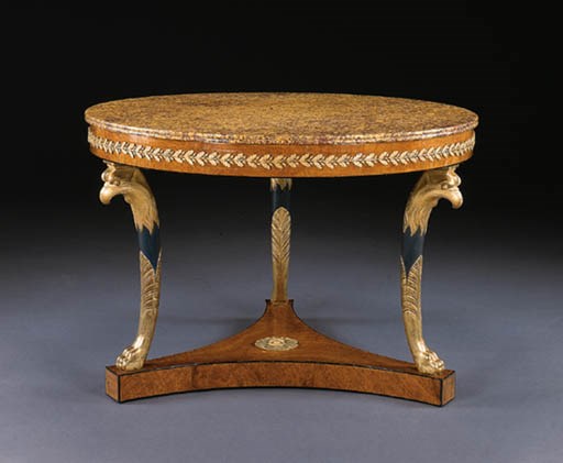 AN EMPIRE ORMOLU-MOUNTED AMBOYNA AND PARCEL-GILT AND EBONIZED CENTER TABLE