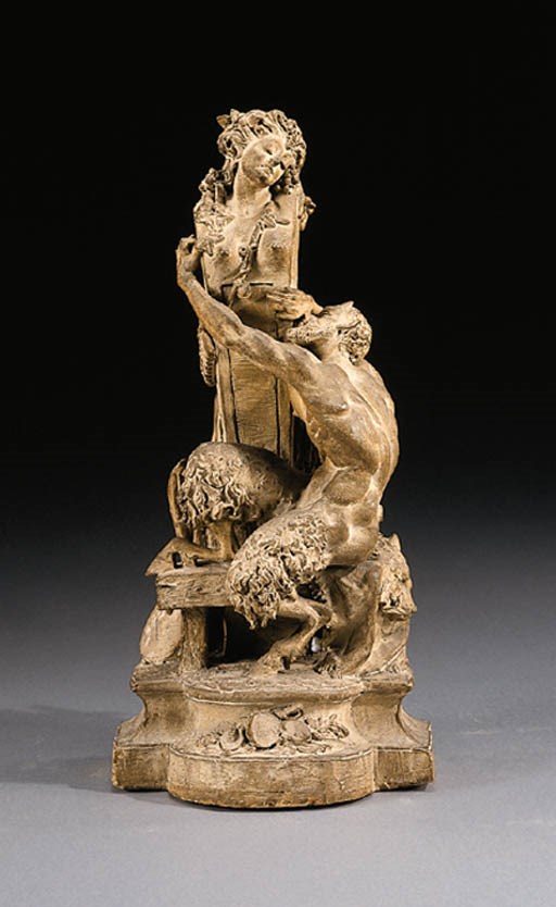 A FRENCH TERRACOTTA FIGURE GROUP