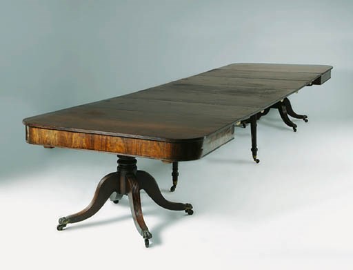 A REGENCY MAHOGANY CONCERTINA-ACTION DINING-TABLE
