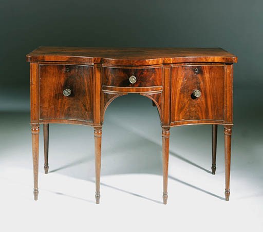 A GEORGE IV MAHOGANY SERPENTINE SIDEBOARD