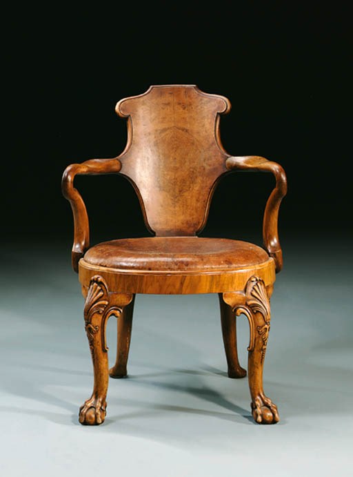 A SET OF FOUR WALNUT OPEN ARMCHAIRS