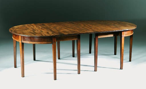 A GEORGE III MAHOGANY DINING-TABLE