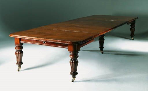 AN EARLY VICTORIAN MAHOGANY EXTENDING DINING-TABLE