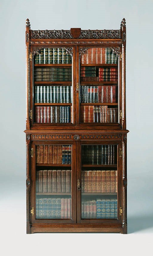 A LATE VICTORIAN WALNUT BOOKCASE