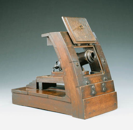 A GEORGE III METAL-MOUNTED AND STAINED-BEECH MODEL OF A CARRONADE