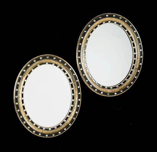 A PAIR OF IRISH GILTWOOD AND EBONISED MIRRORS
