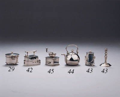 A Dutch silver miniature iron on stand