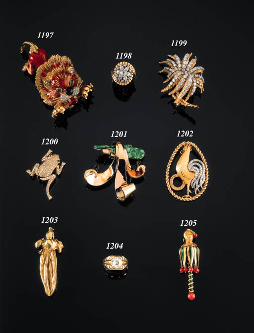 A GOLD, DIAMOND, CORAL AND ENAMEL JESTER CLIP BY VAN CLEEF & ARPELS