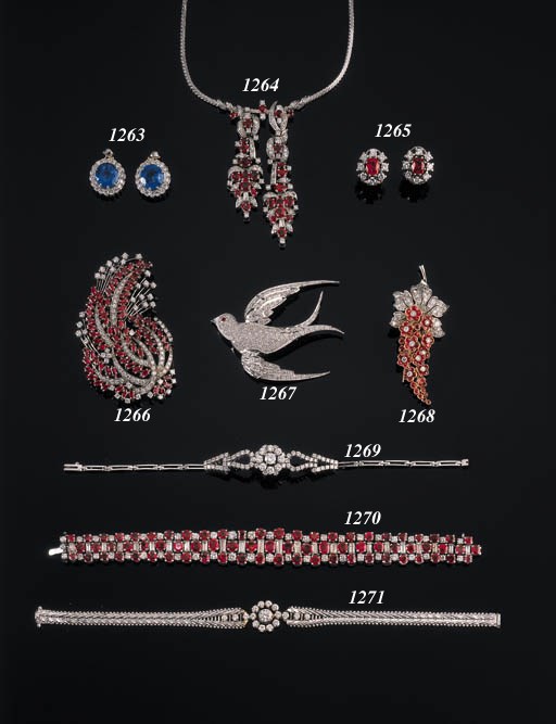 AN ELEGANT RUBY AND DIAMOND FLOWER BROOCH